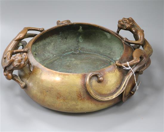 A large Chinese bronze dragon censer, Xuande mark length 38cm